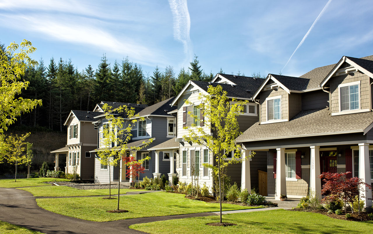 Row of homes along a sidewalk in Tehaleh