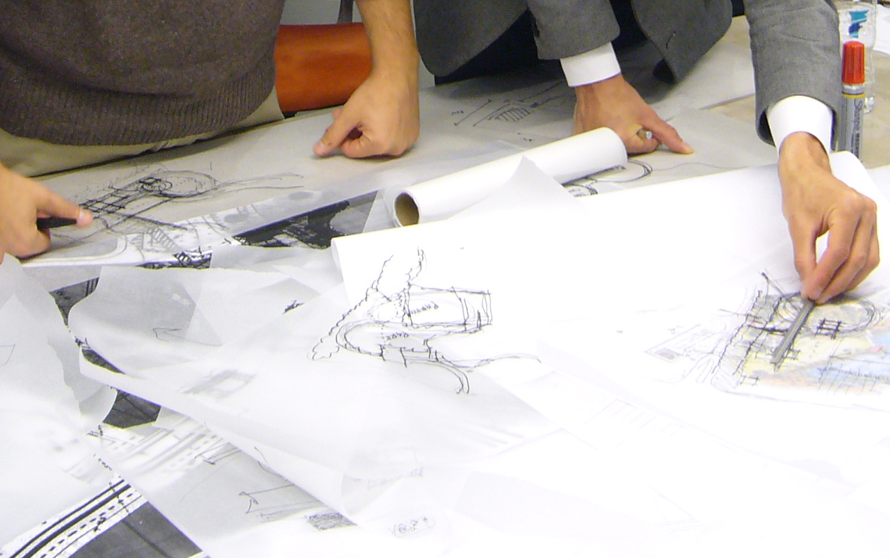 Two people looking at renderings